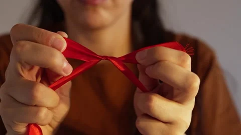 How to make red ribbon bow Stock Footage 245011396