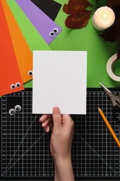 How to make a simple ghost craft. Step 1. Take a sheet of thick white paper.  Stock Photos