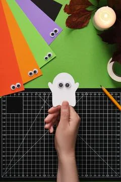 How to make a simple paper craft. An idea for hobbies and creativity. A hand  Stock Photos