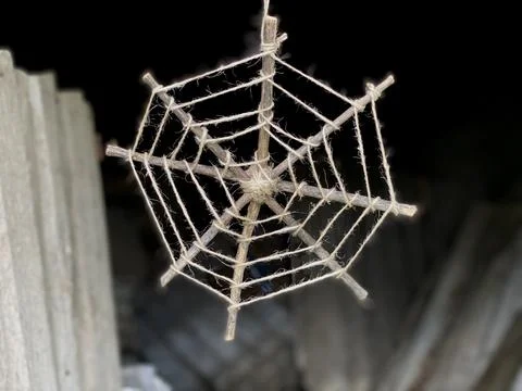 How to make a web from sticks and rope, step by step, children's master class. Stock Photos