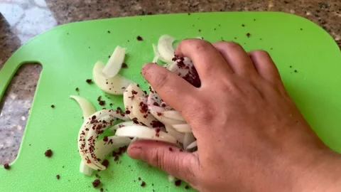 How to Mix and Rub Sliced Onions with Sumac for Musakhan Stock Footage 345321827