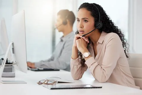 How much longer before my shift ends...a young call centre agent looking bored Stock Photos