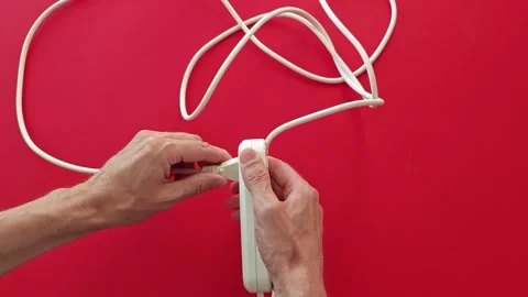 How to neatly organize and store an extension cord in simple steps Stock Footage 345089503
