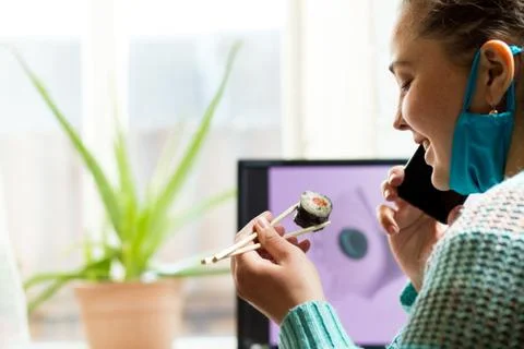 How not to get bored during quarantine. Order sushi at home. Anti stress for  Foto stock