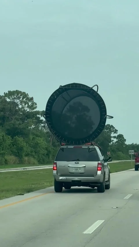 How Not to Move a Trampoline 101, Fort Pierce, Florida, USA - 05 Jun 2025 Stock Footage 310967015