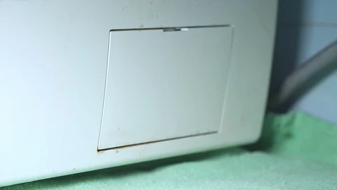 How to open the Filter of an old and dirty Washing Machine, Close up Stock Footage 107151886