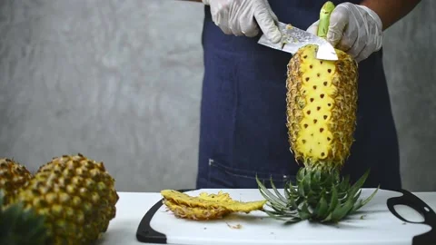 How to peel pineapple Stock Footage 159317421