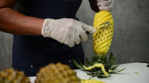 How to peel pineapple Stock Footage 159317423
