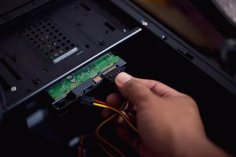 How to plug the power supply cable to hdd Stock Photos