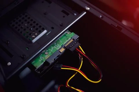 How to plug the power supply cable into the hdd desktop computer Stock Photos