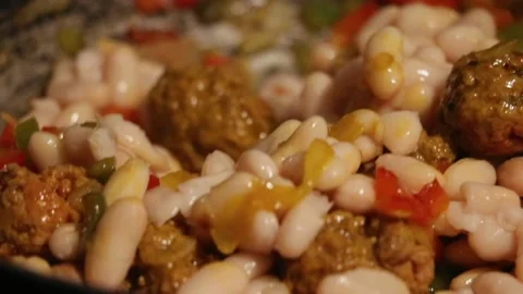 How to prepare white beans with beef meatballs Stock Footage 131752603