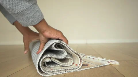 How to properly roll up a rug for storage Stock Footage 319368358