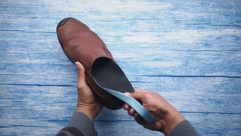 How to replace shoe insoles for better comfort Stock Footage 336882267