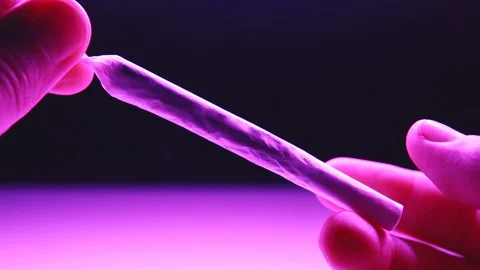 How to roll a perfect joint close-up. Smoking accessories  Stock Footage 101444890