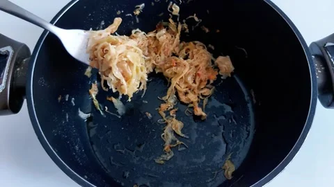 How to Saute Shredded Cabbage and Onions in a Pot. Quick Cooking Tips Video stock 329404285