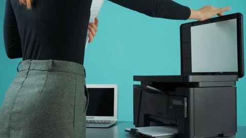 How to scan documents using a multifunction printer in a home office setup 動画素材 299562570