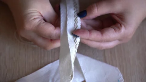 How to sew a simple seam by hand with clear steps and close-up views Video stock 329559790