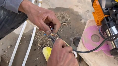 How to Strip and Prepare Wires for Water Pump Installation Stock Footage 345611836