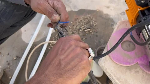 How to Strip Electric Wires Using Pliers for Installation Stock Footage 345611831