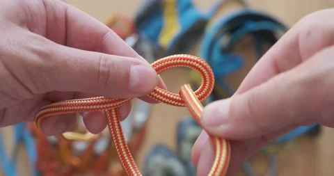 How to tie a single eight on a rope, part of a stopper knot. Figure 8 knot. Stock Footage 141718365