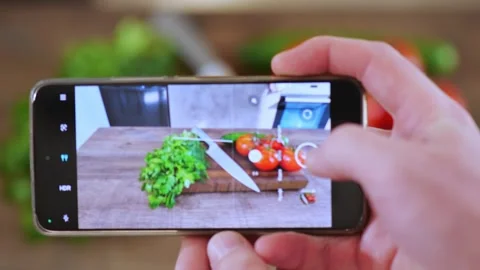 How tomatoes and cucumbers lie on a cutting board Stockbeeldmateriaal 255461577