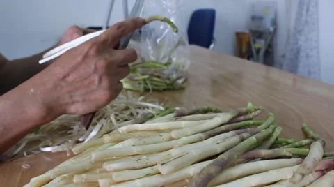 How to trim asparagus Stock Footage 56084944