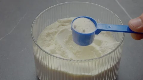 How to use powdered milk in a simple storage container method Stock Footage 327582295