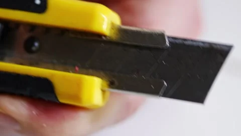 How to use a utility knife safely for cutting tasks Stock Footage 333684685