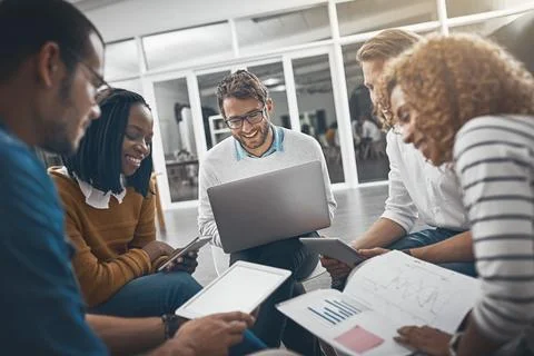 This is how we tackle our problems. colleagues having a meeting in the office. Stock Photos