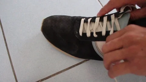 How to wear a shoe Stock Footage 73059766