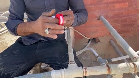 How to Wrap Teflon Tape on Pipe Threads for Leak Prevention Stock Footage 345611736