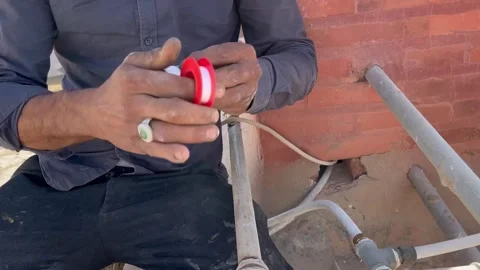 How to Wrap Teflon Tape on Pipe Threads for Leak Prevention Video stock 345740897