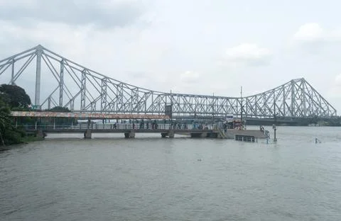 The Howrah Bridge, a balanced attached cantilever bridge covering over the Ho Stock Photos