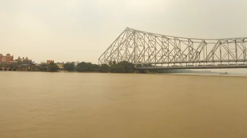 Howrah bridge view from floating boat under construction buildings of city Kolka Stock Footage 105517815