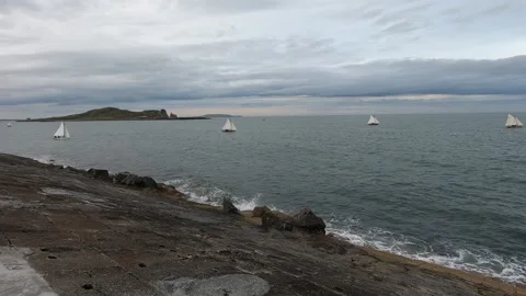 Howth, Ireland - May 13, 2025: Sailboats on the ocean of Howth Stock Footage 309727385