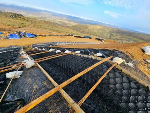 HPDE geocell installation process in hydraulic ditches Stock Photos