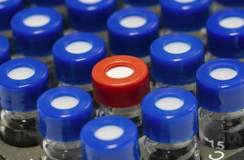 HPLC glass vials in the rack. Stock Photos
