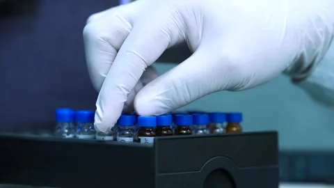 HPLC machine science experiment Vial filling inside an autosampler of an HPLC ma Stock-Footage 293166616