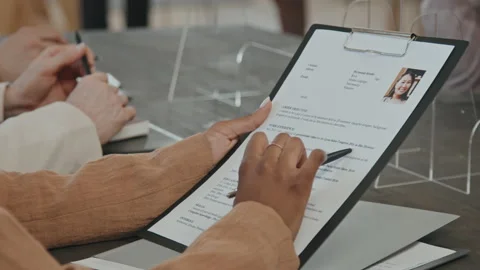 HR Looking at Application Form During Job Interview Stock Footage 163972648