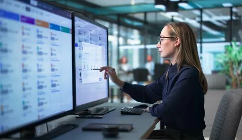 HR Manager Analyzes Payroll Data On Computer For Precise Employee Salary. Stock Photos
