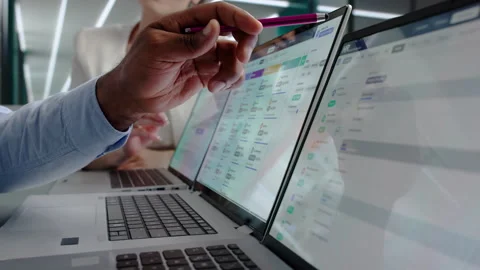 HR Manager And Payroll Specialist Reviewing Employee Salary Data Stock Footage 343882086