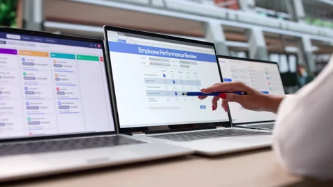 HR Manager Evaluates Employee Performance Using Laptop Stock Footage 341000065