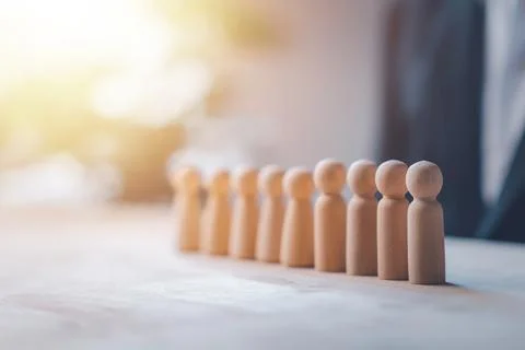 HR manager (human resources) or Employer. Person wooden doll is leader stan.. Stock Photos