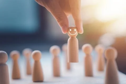 HR manager (human resources) or Employer hand choose takes person wooden do.. Stock Photos