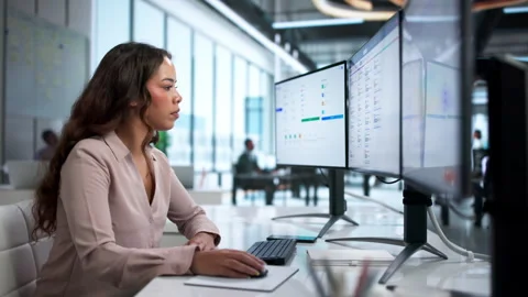 HR Manager Reviewing Employee Data On Computer Stock Footage 335459127