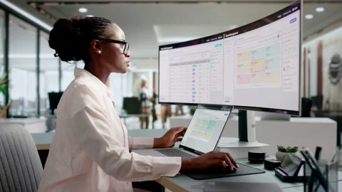 HR Manager Reviewing Employee Performance Data On Laptop Stock Footage 344720188