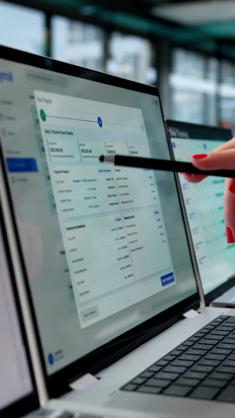 HR Manager Reviewing Payroll Software Data On Laptop Stock Footage 339174195