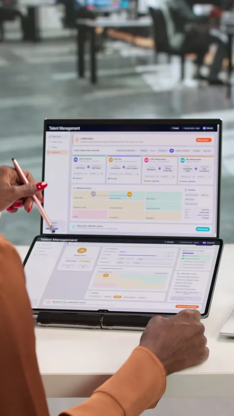 HR Manager Reviews Employee Performance Data On Laptop Stock Footage 337228724