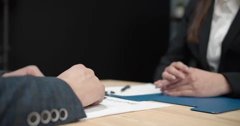 HR manager shaking hands to congratulate new employee Stock Footage 125498250