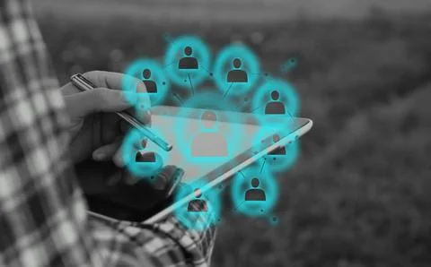HR manager using digital tablet with holographic network interface for empl.. Stock Photos